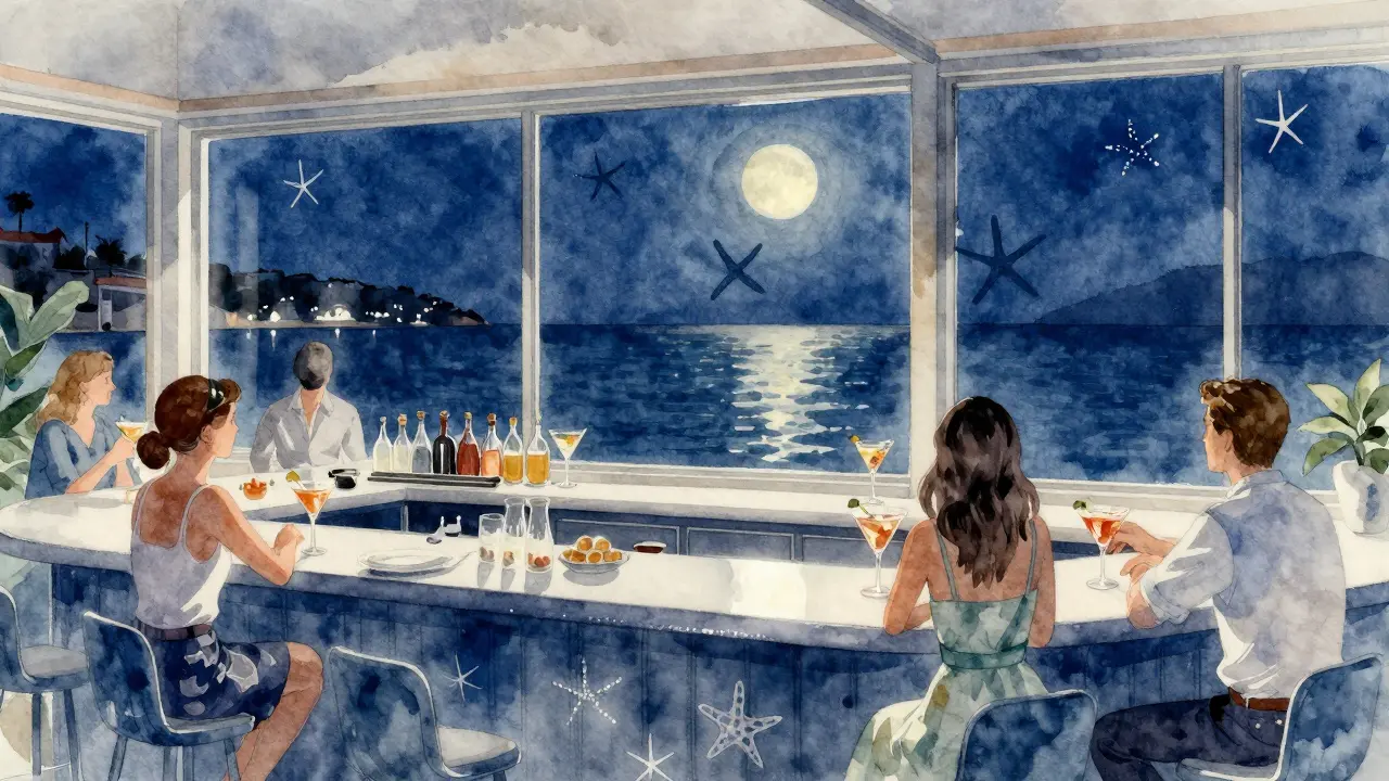 Guests enjoying cocktails at Oceanographic Museum bar with Mediterranean views at night.