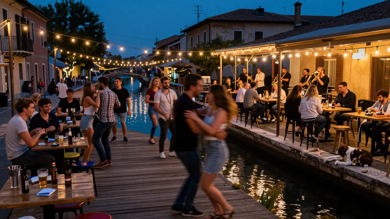 People dancing along Naviglio Grande’s canal at night, fairy lights reflecting on water and a DJ setting up.